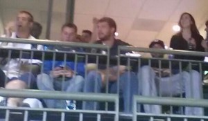 OK, so it's blurry. I took the picture backwards using my cell phone. That's Jordy Nelson on the left and Aaron Rodgers is on the right, leaning back. His light denim legs and Milwaukee Brewers cap are visible. This was two years ago and I had just started to used a smart phone that is smarter than I am.